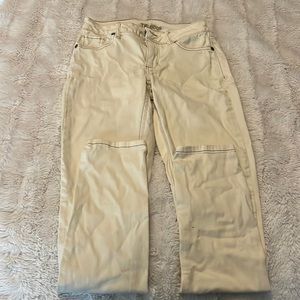 Off white/ khaki colored skinny jeans.